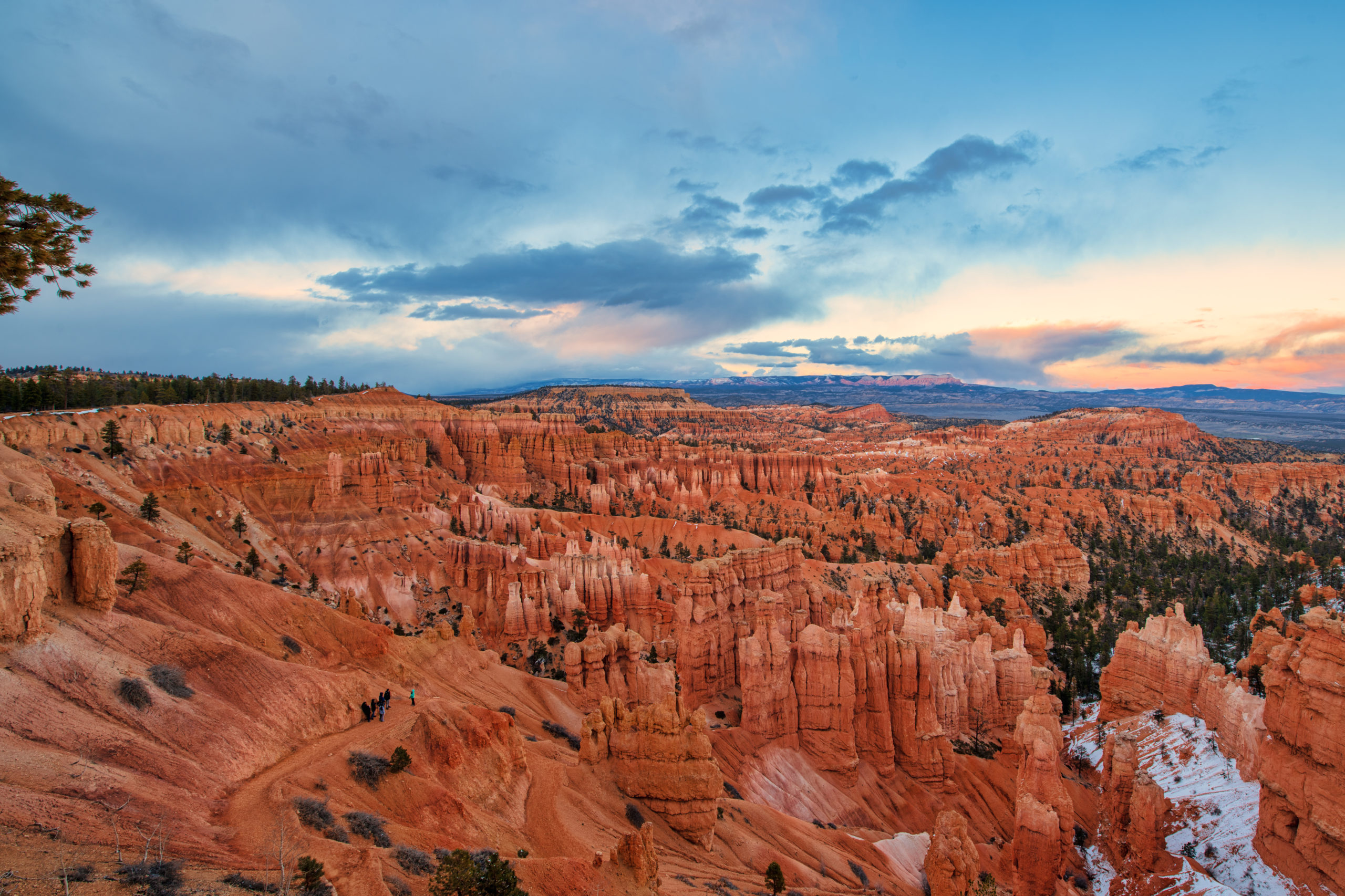 the landscape at Bryce Canyon National Park is beautiful and colorful at sunset